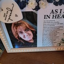 Memorial frame with a photo of Becky beside the poem &ldquo;As I sit in heaven&rdquo;